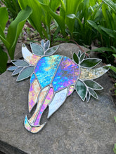 Iridescent skull with leaves