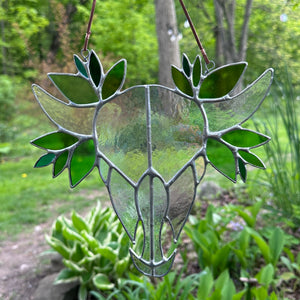 Iridescent skull with leaves