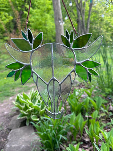 Iridescent skull with leaves